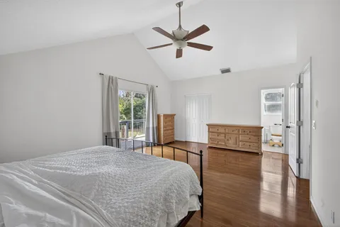 a view of balcony with wooden floor and fence