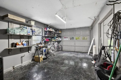 a view of a yard with large trees