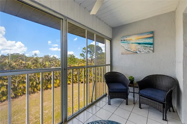 a chairs and a table in a balcony