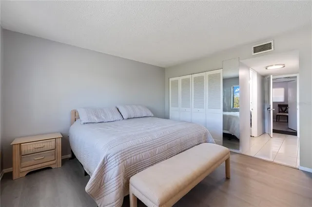 a bedroom with a bed and a walk in closet