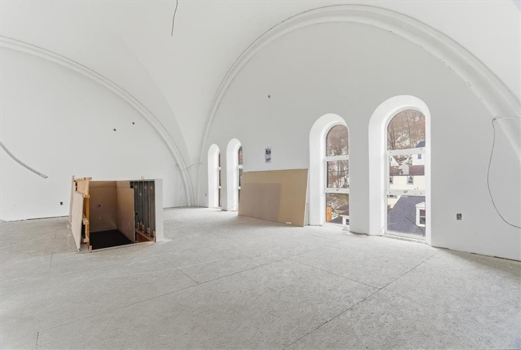 1 Pius Street, Unit A4 Pittsburgh, PA 15203 - Photo 11 of 40 view from kitchen into dining area with stairs down to lower level & entry to the left