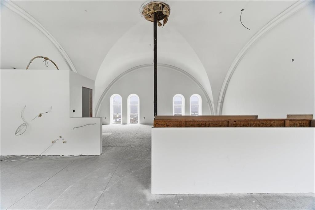 1 Pius Street, Unit A4 Pittsburgh, PA 15203 - Photo 20 of 40 view from dining area into kitchen on left and living area beyond pole