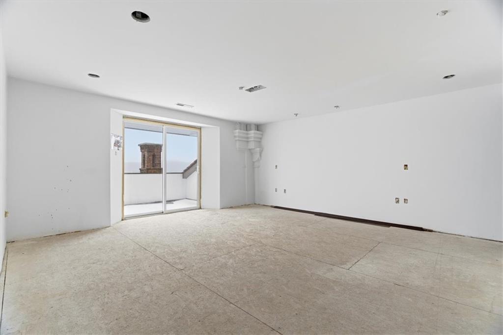 1 Pius Street, Unit A4 Pittsburgh, PA 15203 - Photo 22 of 40 primary bedroom with walk-in closet and en-suite bathroom & balcony