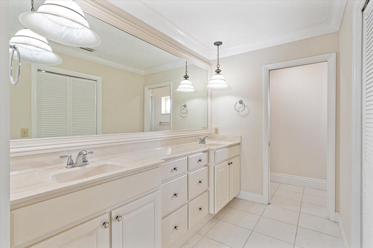 3261 Southeast Fairway West Stuart, FL 34997 - Photo 13 of 44 a bathroom with a granite countertop sink mirror and