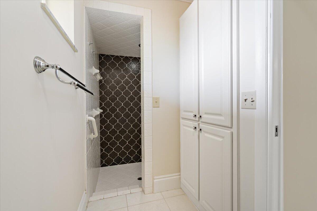 3261 Southeast Fairway West Stuart, FL 34997 - Photo 14 of 44 a bathroom with a bathtub