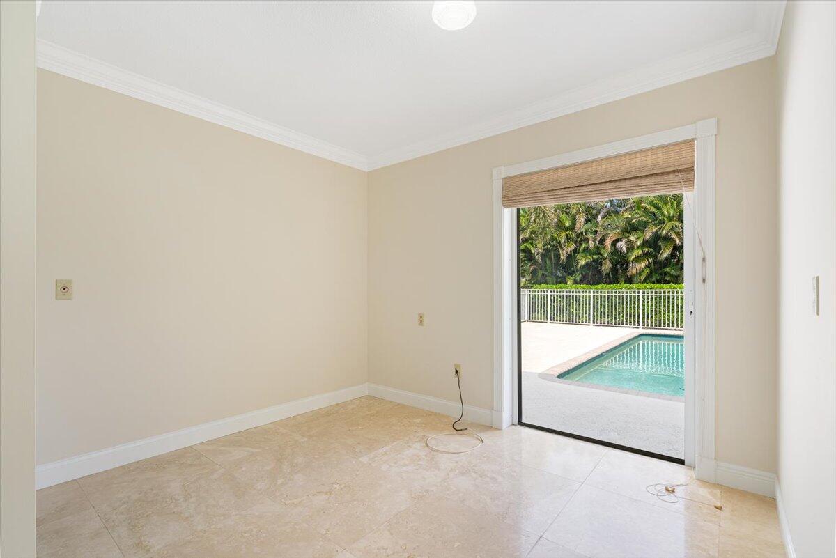 3261 Southeast Fairway West Stuart, FL 34997 - Photo 19 of 44 an empty room with a sliding door