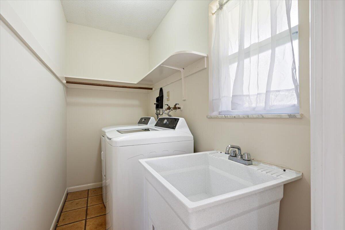 3261 Southeast Fairway West Stuart, FL 34997 - Photo 21 of 44 a utility room with dryer and washer
