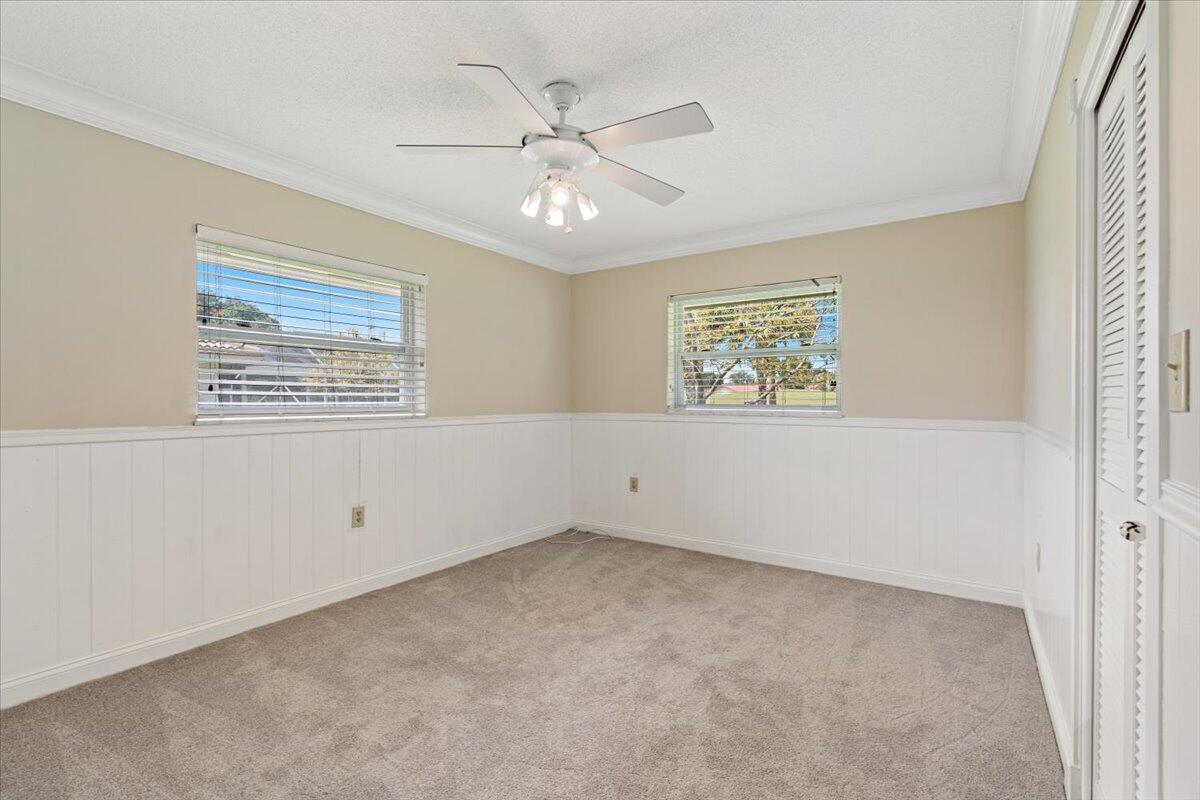 3261 Southeast Fairway West Stuart, FL 34997 - Photo 22 of 44 a view of an empty room with a window