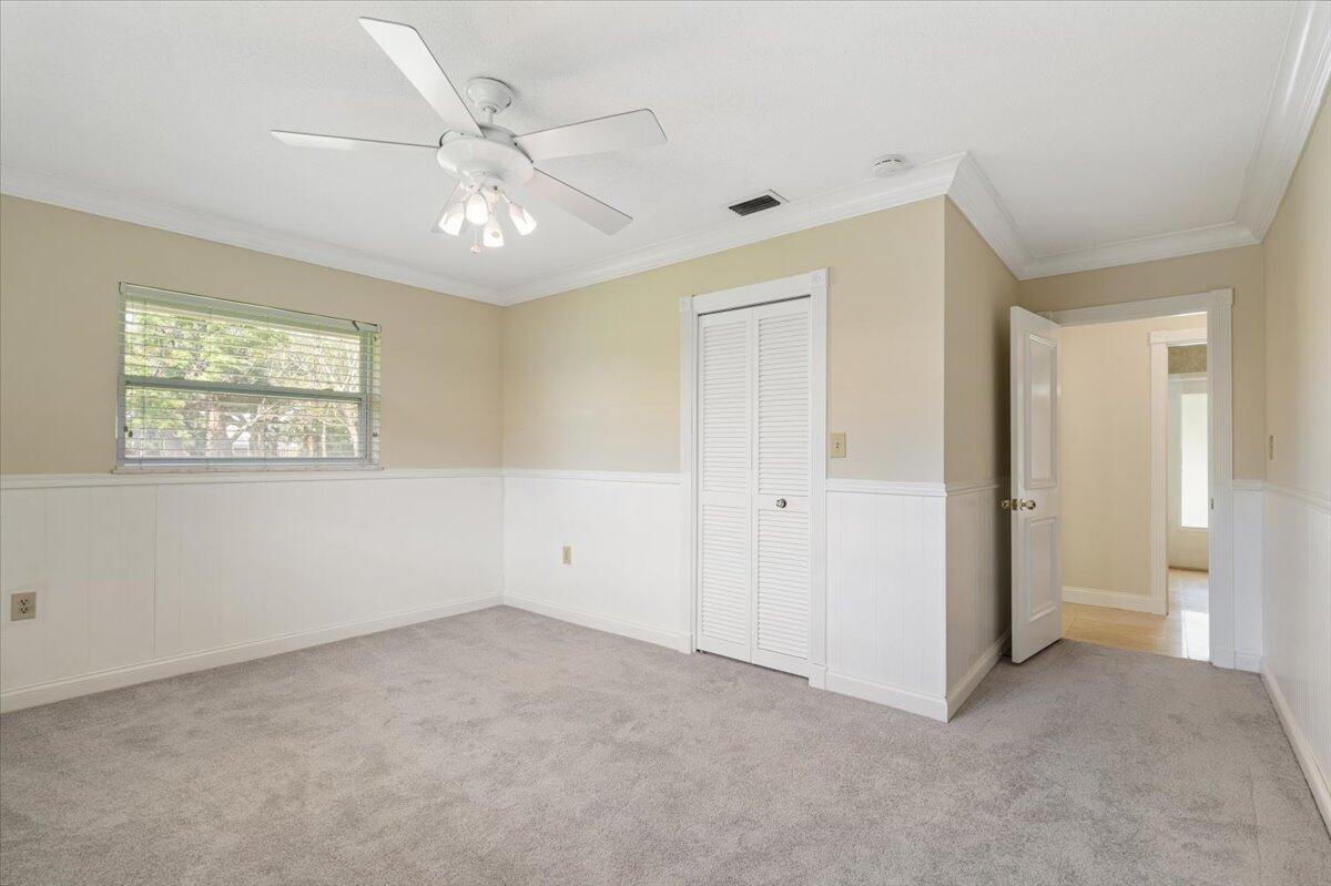 3261 Southeast Fairway West Stuart, FL 34997 - Photo 23 of 44 a view of an empty room with a window