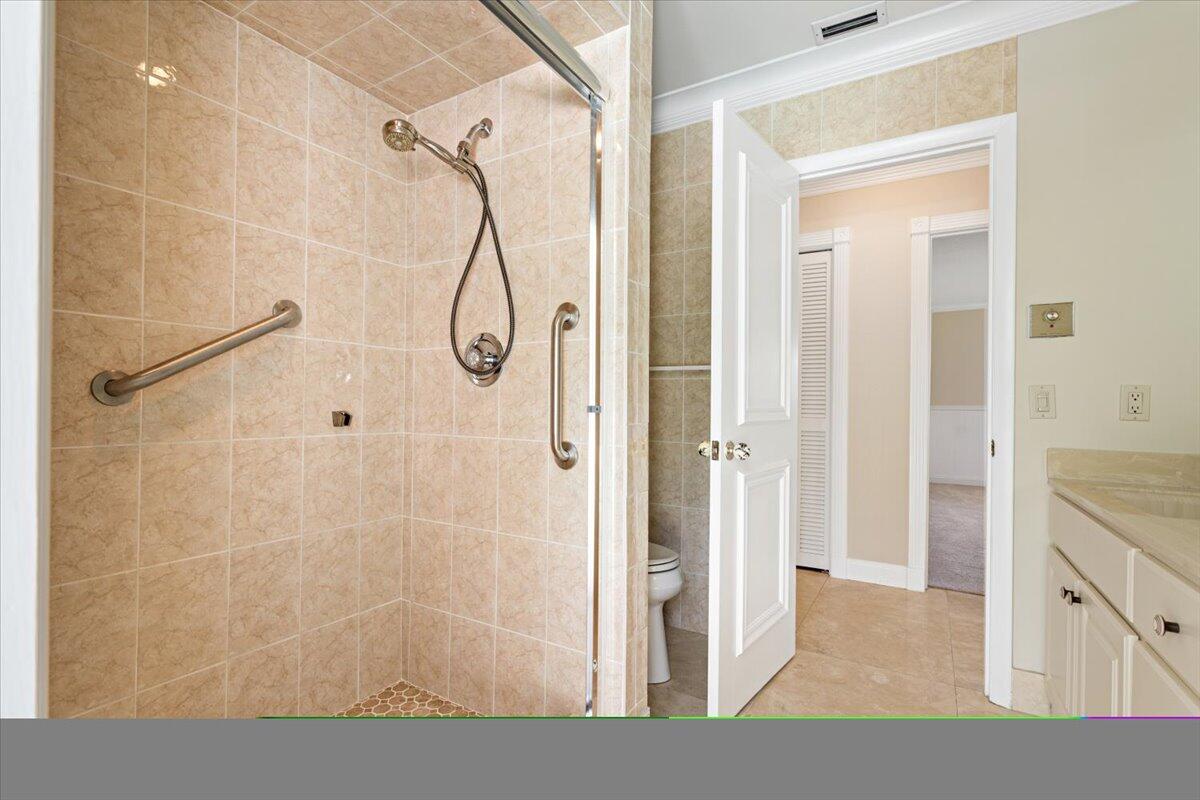 3261 Southeast Fairway West Stuart, FL 34997 - Photo 25 of 44 a bathroom with a granite countertop shower mirror and a sink