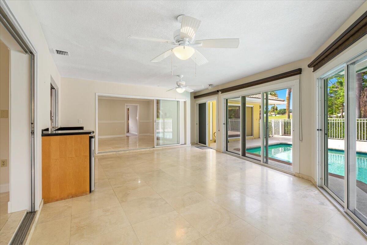 3261 Southeast Fairway West Stuart, FL 34997 - Photo 26 of 44 a view of an empty room with glass door