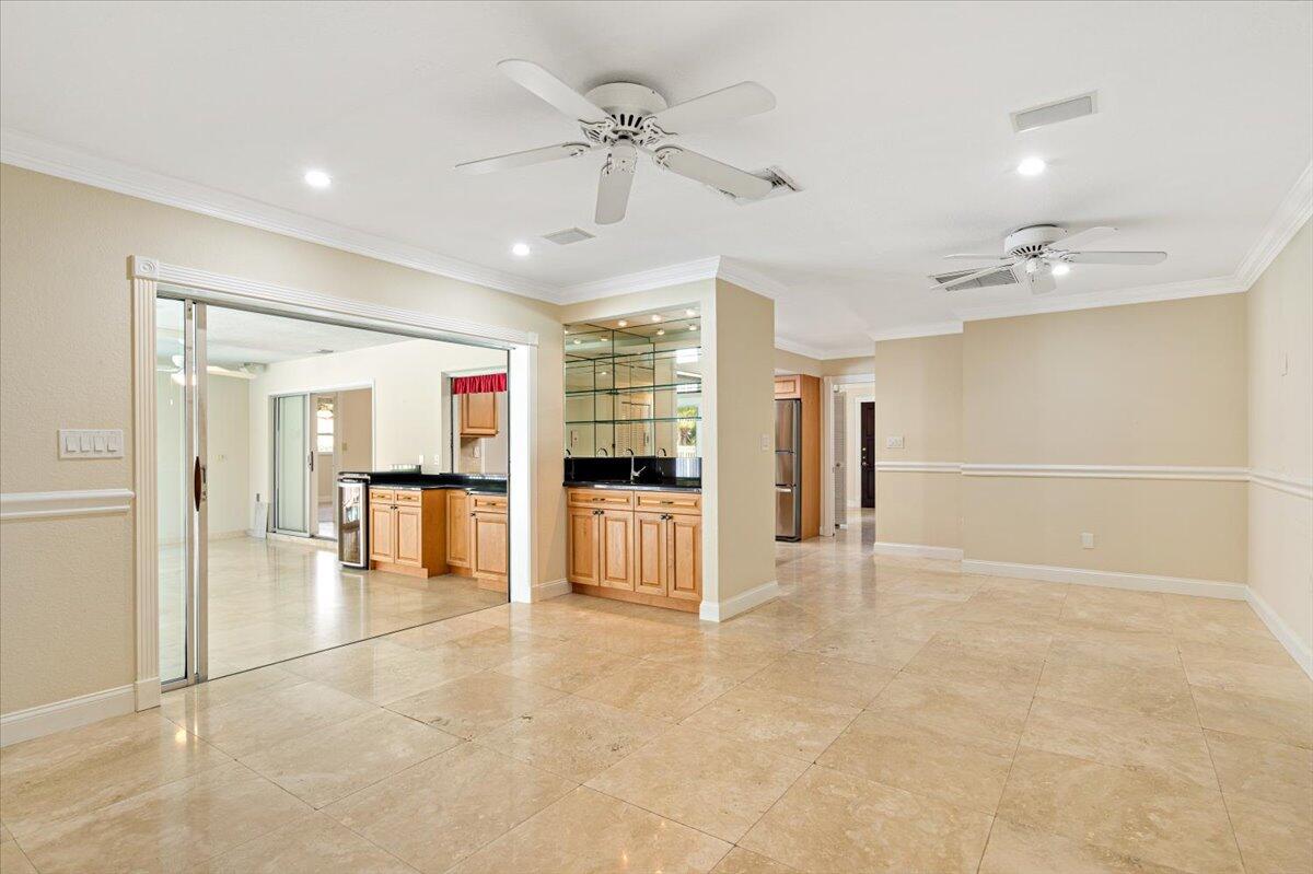3261 Southeast Fairway West Stuart, FL 34997 - Photo 31 of 44 a view of an empty room with a ceiling fan