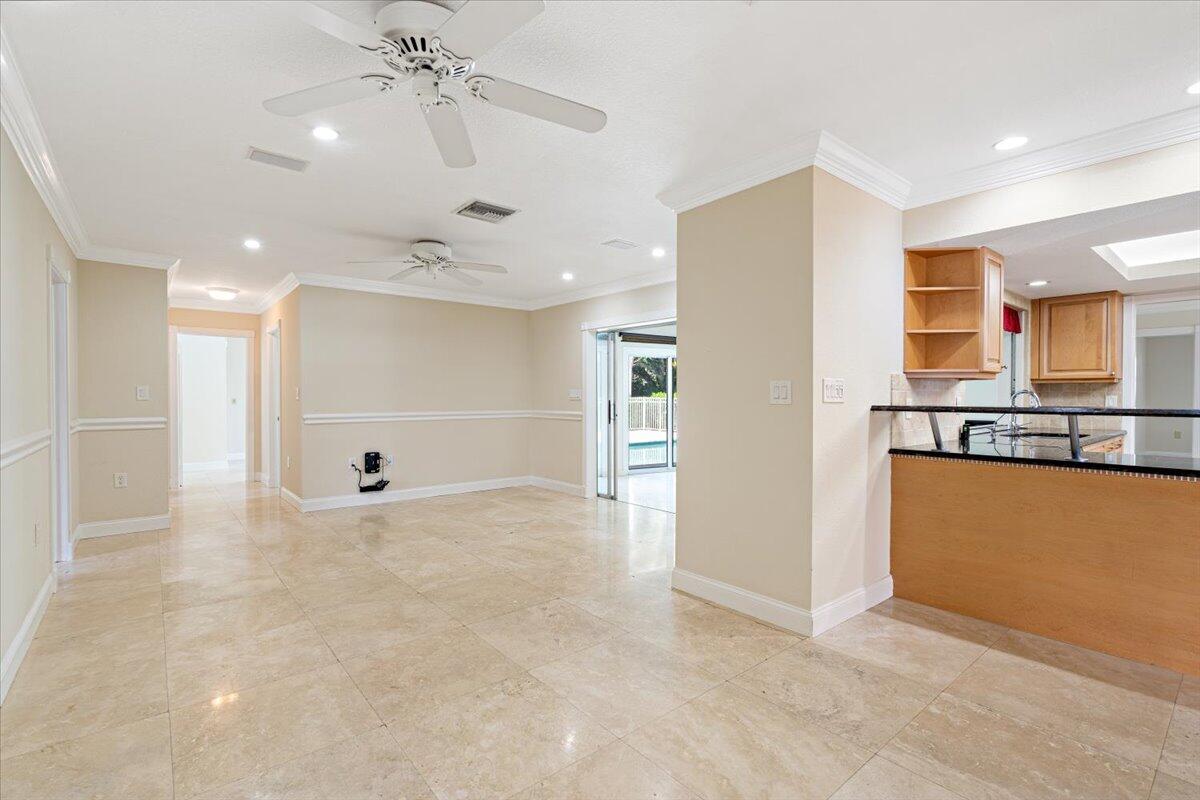 3261 Southeast Fairway West Stuart, FL 34997 - Photo 34 of 44 a view of a kitchen with a sink and a refrigerator