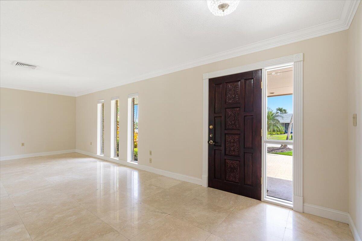 3261 Southeast Fairway West Stuart, FL 34997 - Photo 4 of 44 an empty room with windows and closet