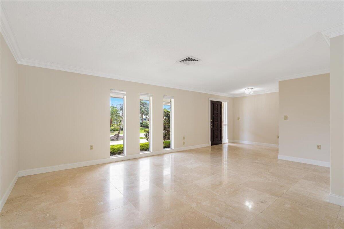 3261 Southeast Fairway West Stuart, FL 34997 - Photo 7 of 44 wooden floor in an empty room with a window
