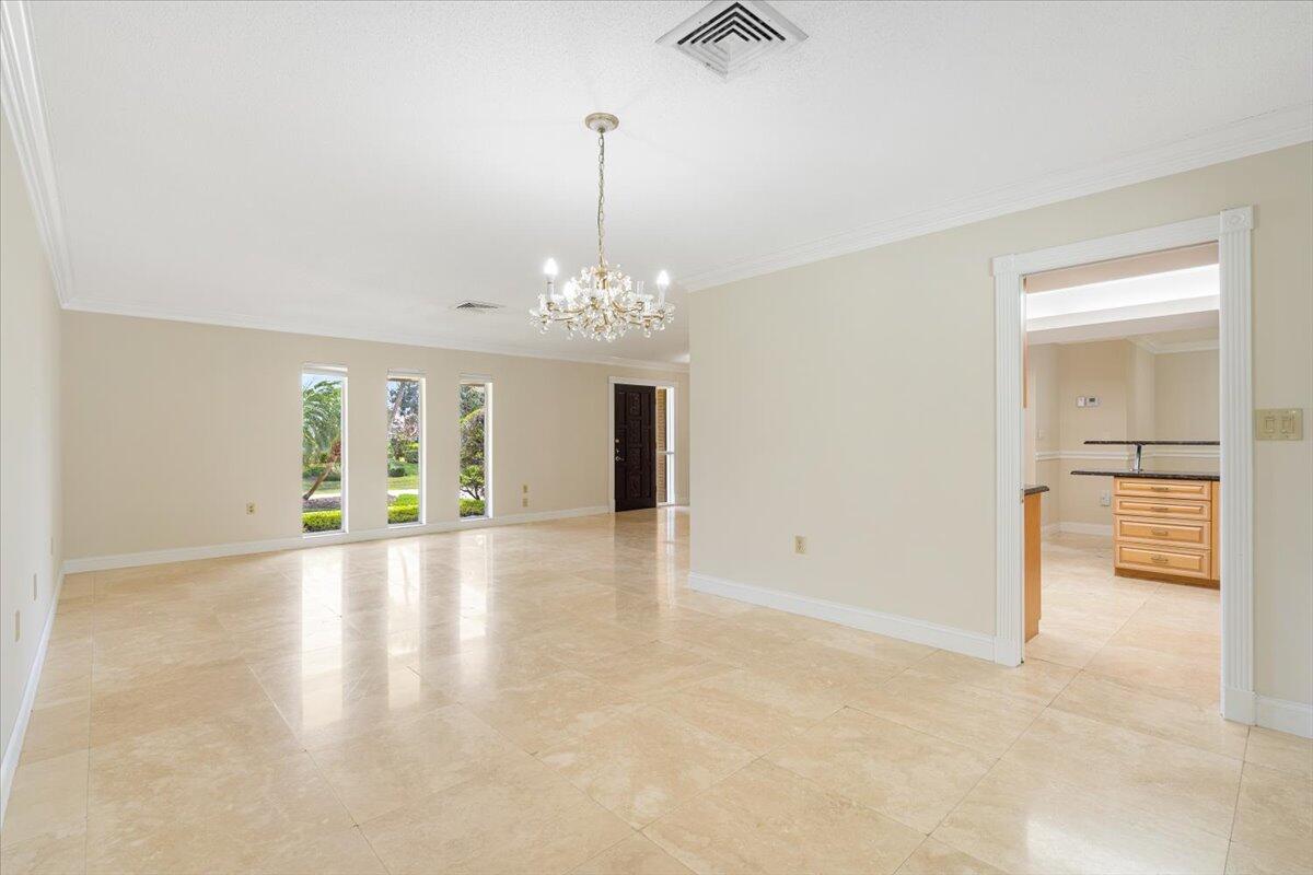 3261 Southeast Fairway West Stuart, FL 34997 - Photo 9 of 44 wooden floor in an empty room with a window