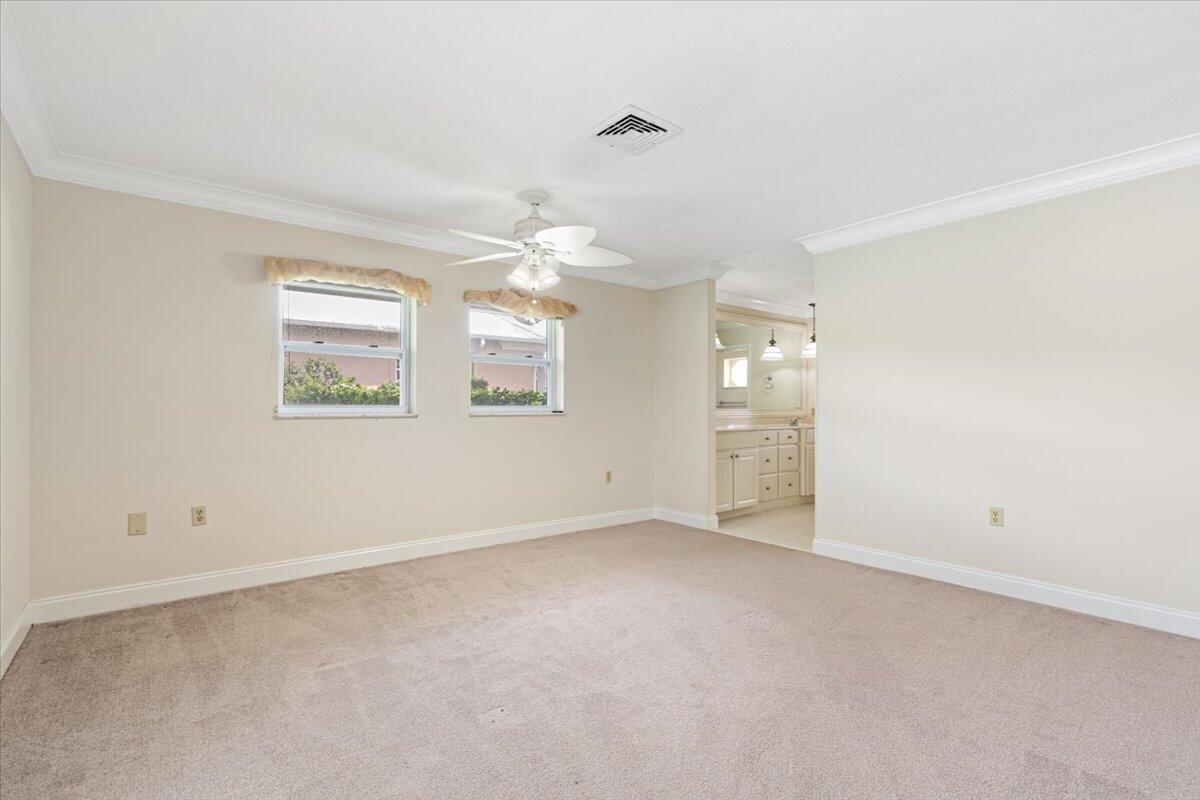 3261 Southeast Fairway West Stuart, FL 34997 - Photo 10 of 44 wooden floor in an empty room with a window