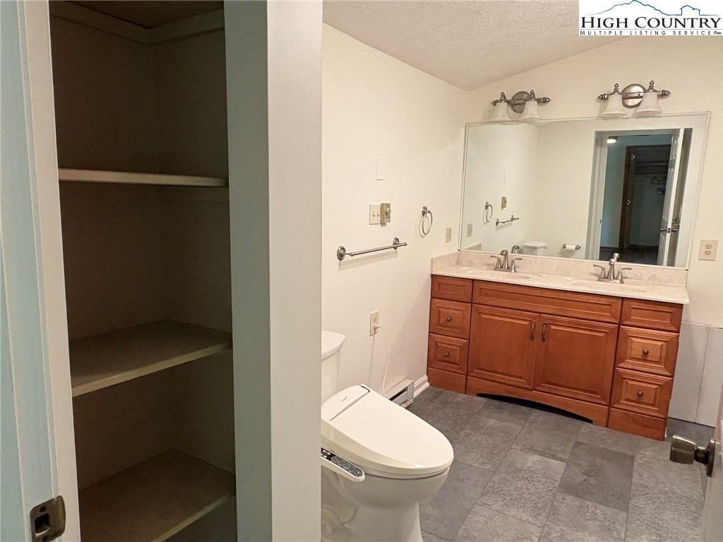 527 Windridge Road Newland, NC 28657 - Photo 16 of 33 a bathroom with a sink toilet and shower