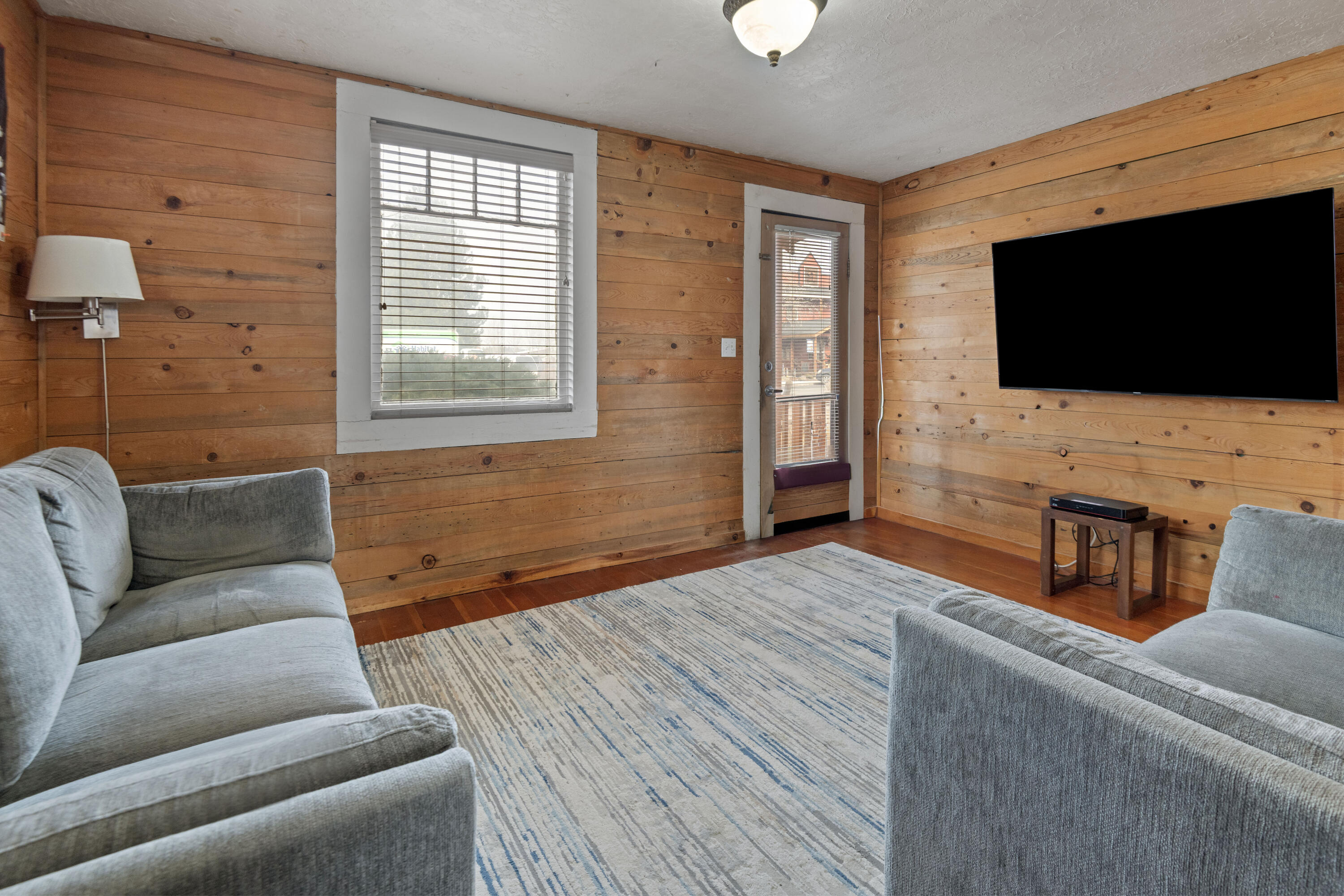 243 West Adams Avenue Sisters, OR 97759 - Photo 4 of 19 a living room with furniture and a flat screen tv