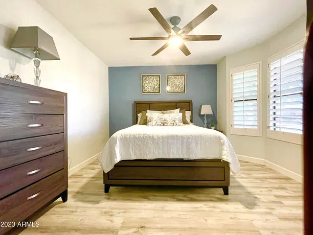 a bed room with a bed and a window