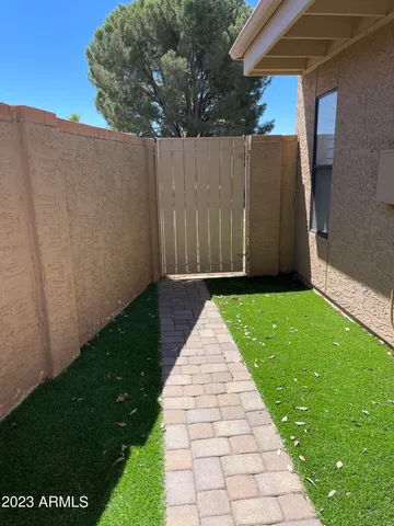 a view of a back yard of the house