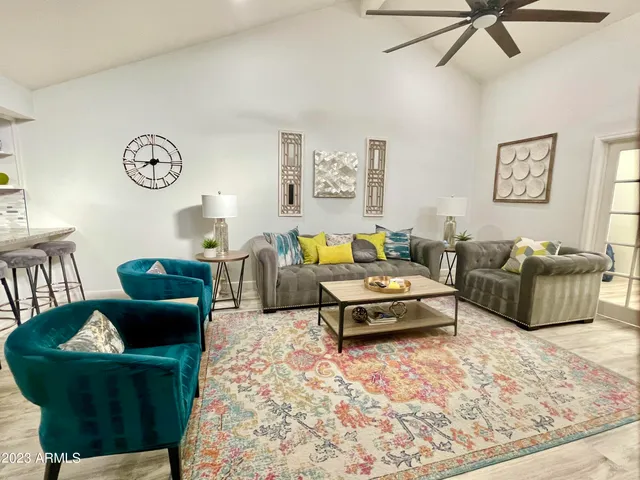a living room with furniture and a rug