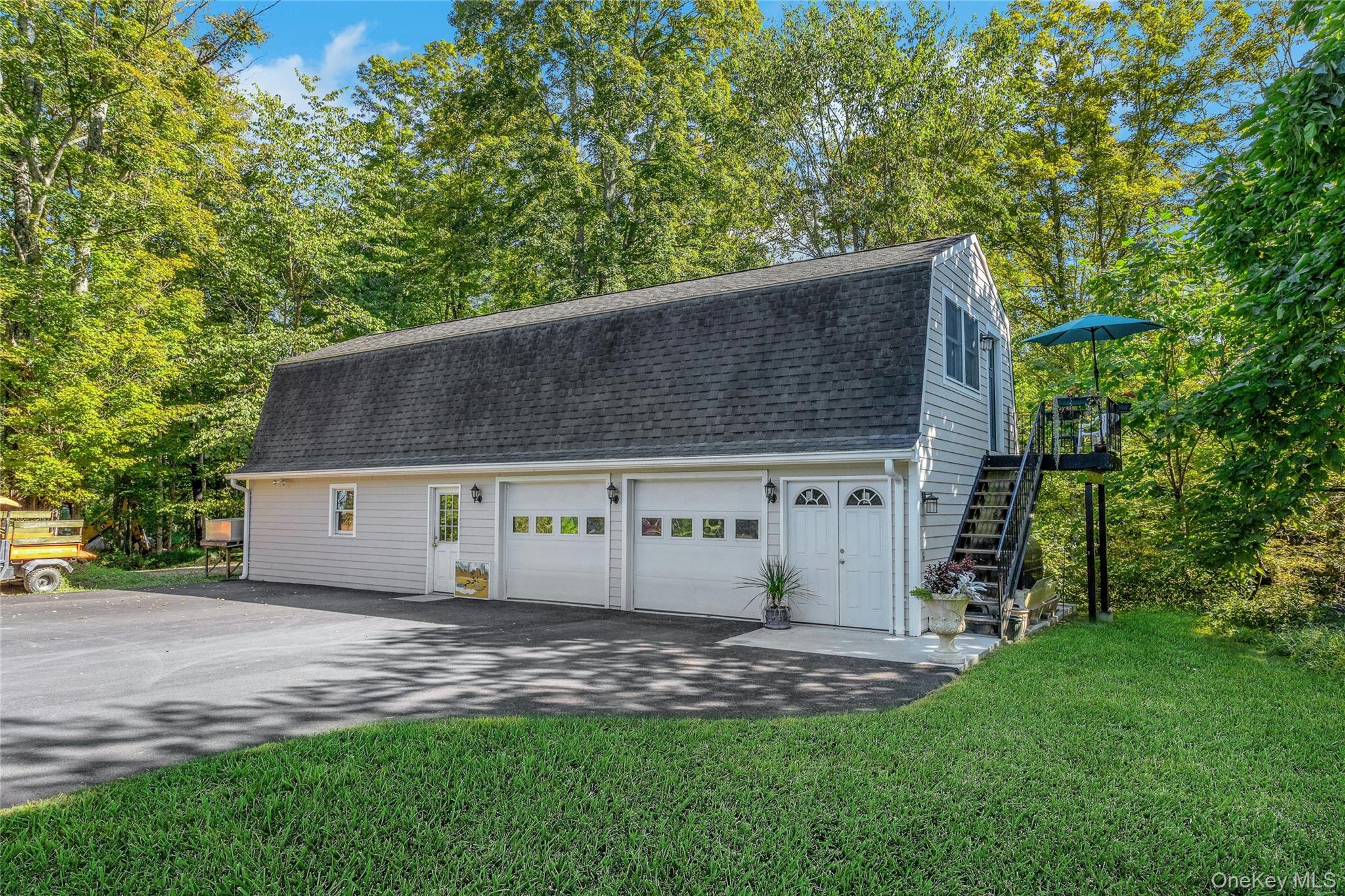 73 Lake Ellis Road Wingdale, NY 12594 - Photo 21 of 41 Garage with view of scattered trees