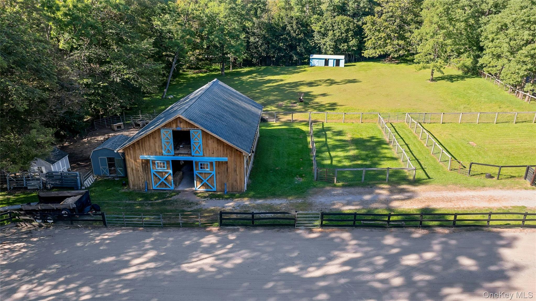 73 Lake Ellis Road Wingdale, NY 12594 - Photo 32 of 41 Aerial view of sparsely populated area featuring agricultural land and a heavily wooded area