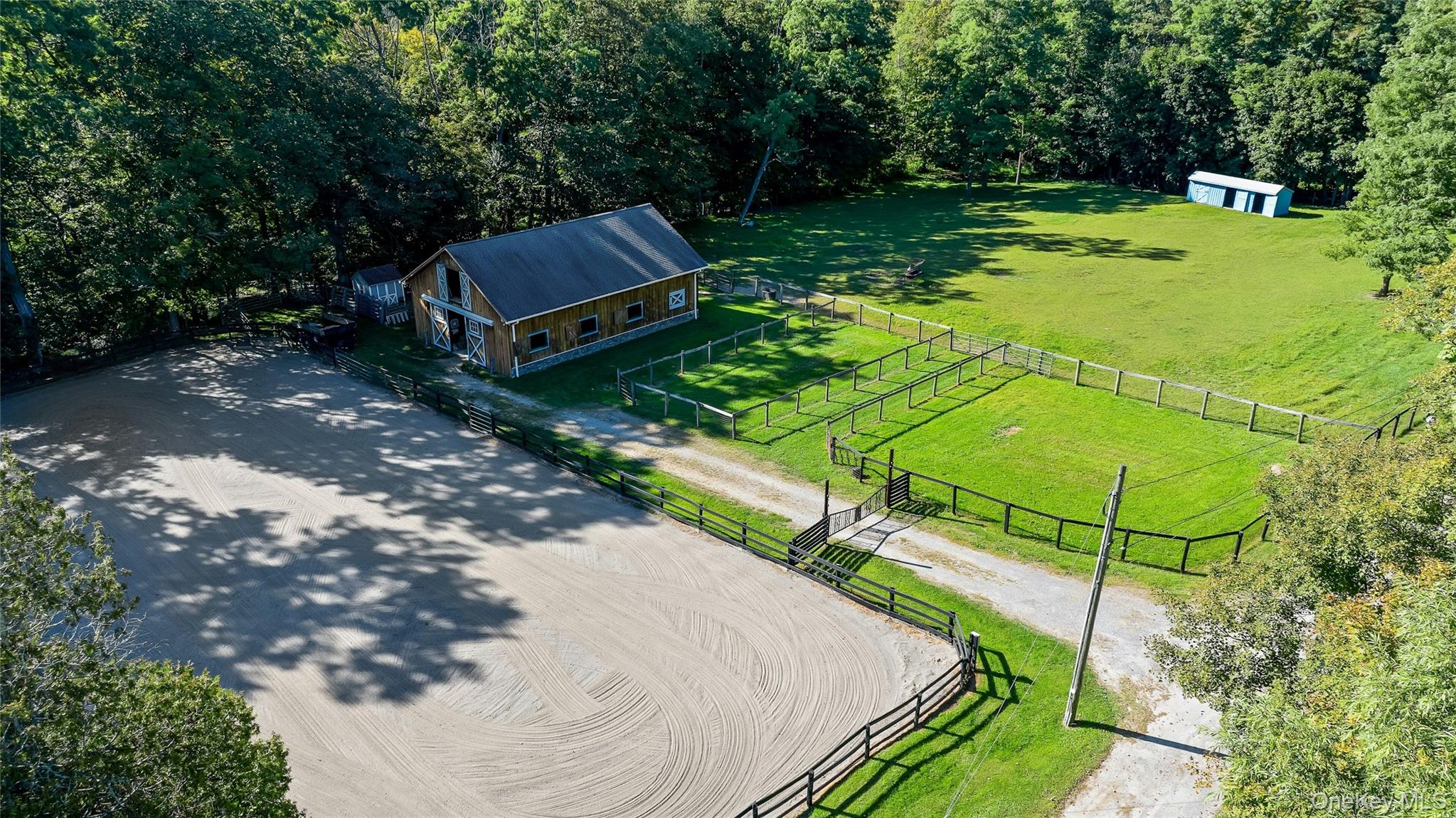 73 Lake Ellis Road Wingdale, NY 12594 - Photo 33 of 41 Overview of rural landscape with a pastoral area and a heavily wooded area
