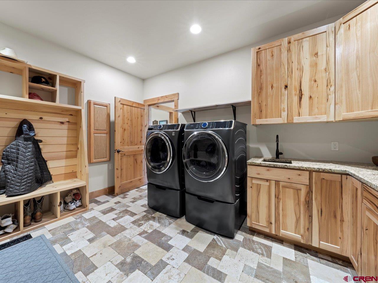 7528 South River Road Olathe, CO 81425 - Photo 24 of 44 a utility room with sink dryer and washer