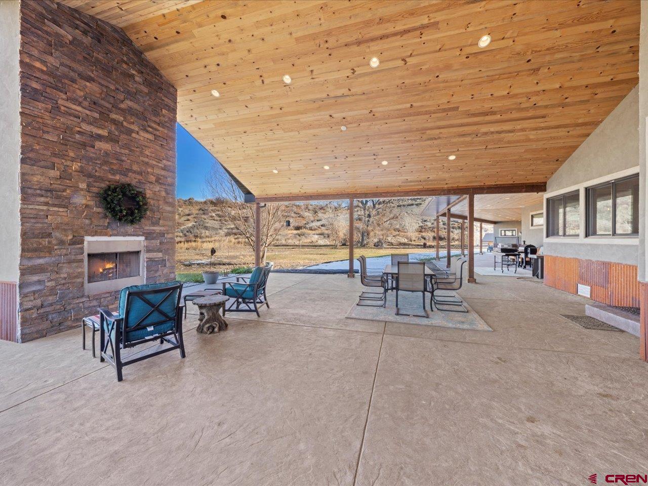 7528 South River Road Olathe, CO 81425 - Photo 31 of 44 a building outdoor space with patio furniture and potted plants