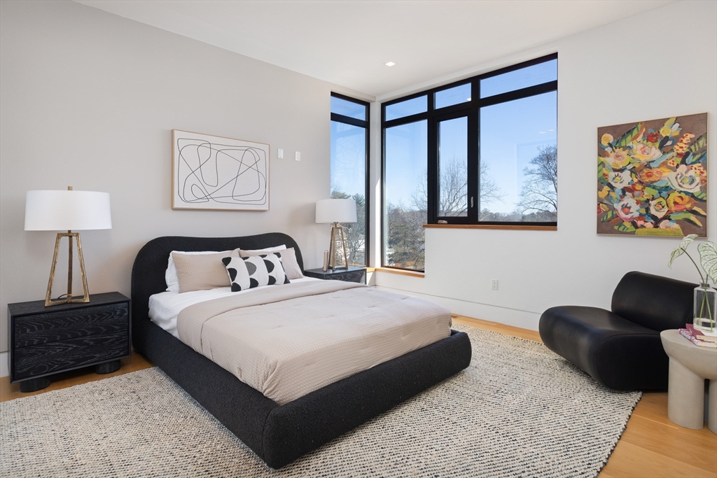 31 Catlin Road Brookline, MA 02445 - Photo 11 of 20 a bedroom with a bed and a couch