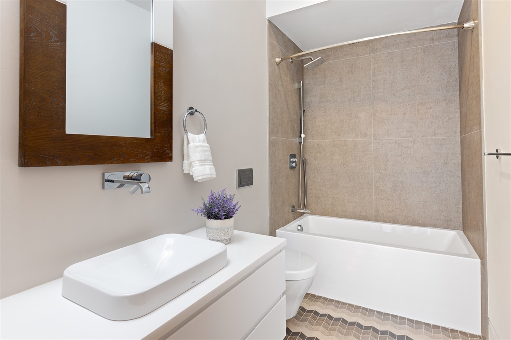 31 Catlin Road Brookline, MA 02445 - Photo 12 of 20 a bathroom with a sink toilet and shower