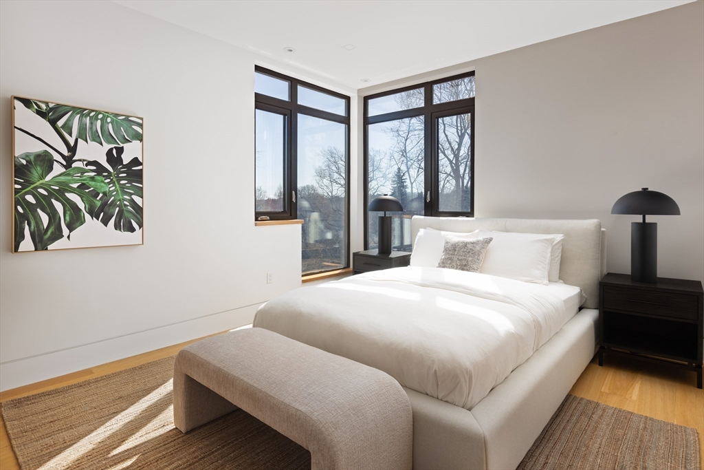 31 Catlin Road Brookline, MA 02445 - Photo 13 of 20 a bedroom with a bed and a large window