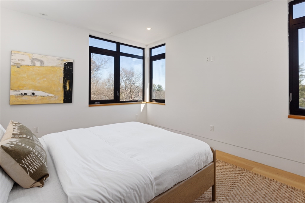 31 Catlin Road Brookline, MA 02445 - Photo 15 of 20 a bedroom with a large bed and a window