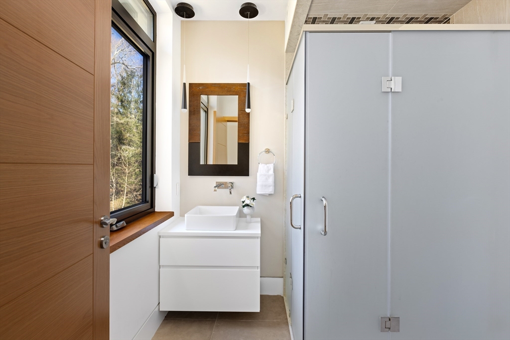 31 Catlin Road Brookline, MA 02445 - Photo 17 of 20 a bathroom with a sink a toilet and shower