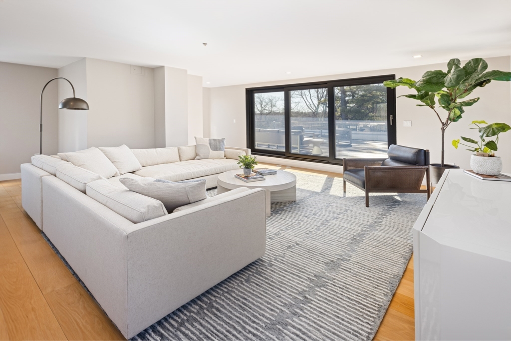 31 Catlin Road Brookline, MA 02445 - Photo 18 of 20 a living room with furniture and a large window