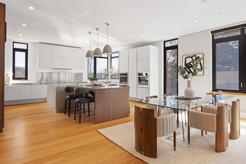 31 Catlin Road Brookline, MA 02445 - Photo 5 of 20 a open kitchen with stainless steel appliances kitchen island granite countertop a sink and cabinets