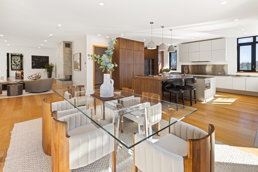 31 Catlin Road Brookline, MA 02445 - Photo 6 of 20 a view of a dining room with furniture a chandelier and kitchen view