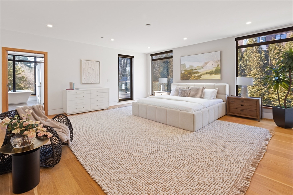 31 Catlin Road Brookline, MA 02445 - Photo 8 of 20 a spacious bedroom with a bed and large windows