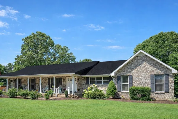 front view of a house with a yard