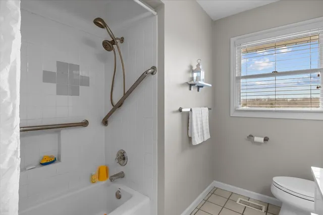 a bathroom with a bath tub and a shower