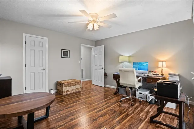 a workspace with furniture and wooden floor