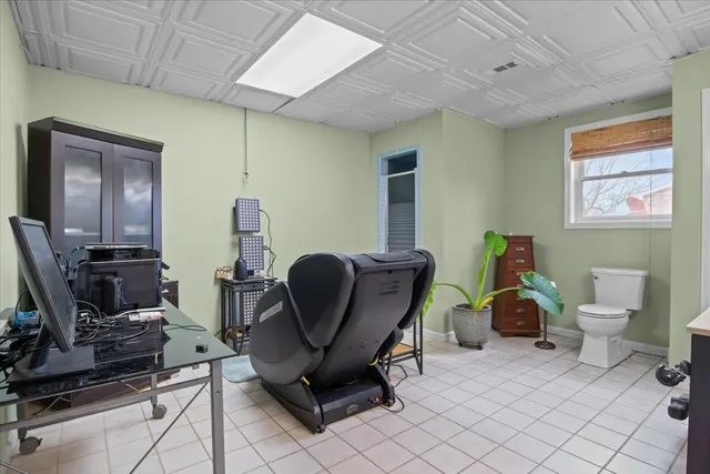 a view of workspace with wooden floor windows gym equipment and windows