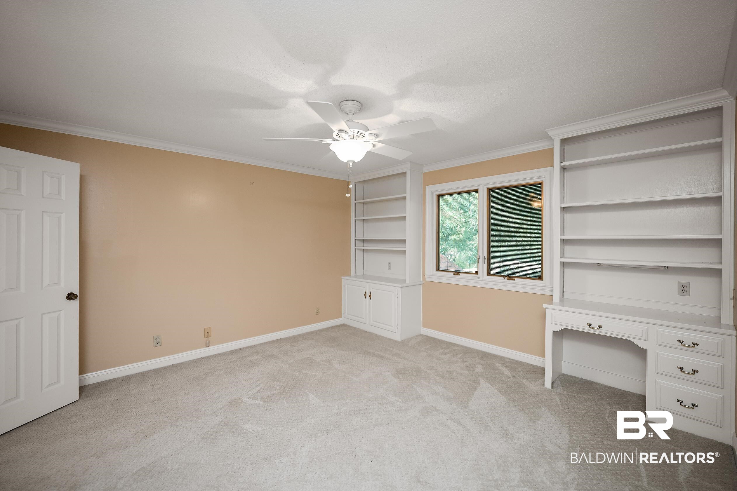 329 Norwood Road Monroeville, AL 36460 - Photo 25 of 49 Carpeted room with a ceiling fan, crown molding, and built-in shelving