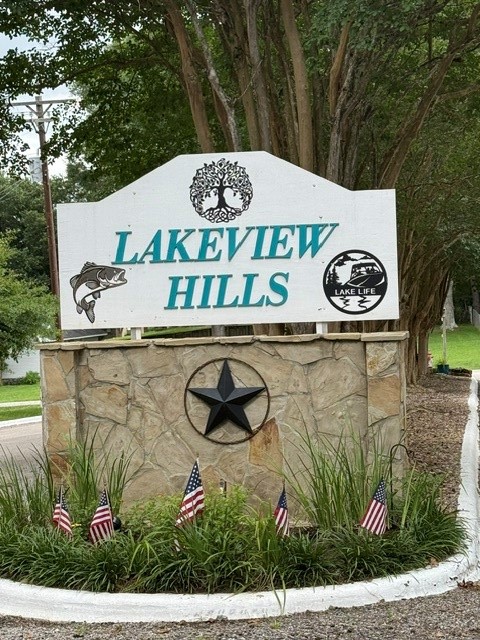 0 Lakeview Place Coldspring, TX 77331 - Photo 1 of 1 a street sign on a wall next to a road