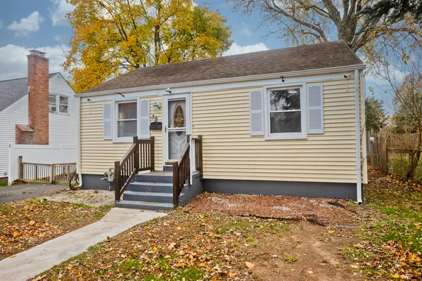 a front view of a house with stairs