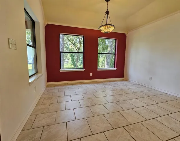a view of an empty room with windows