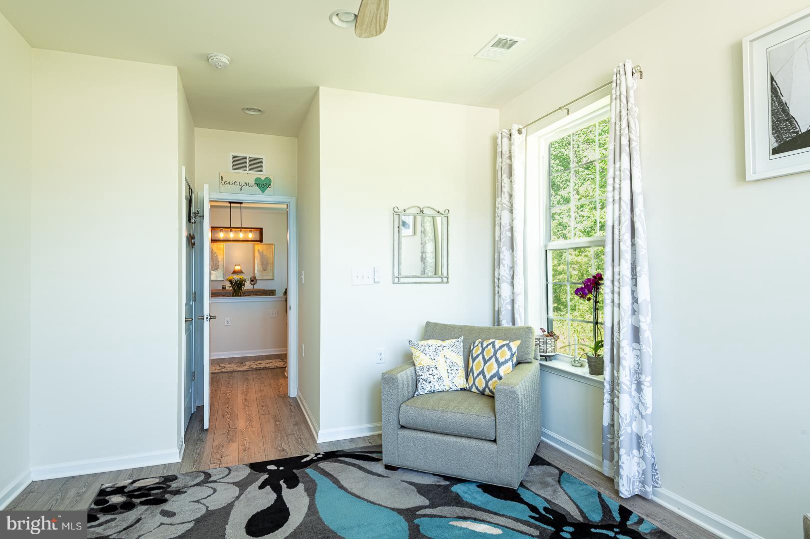314 Tranquility Way Middletown, DE 19709 - Photo 10 of 56 a living room with furniture and a window