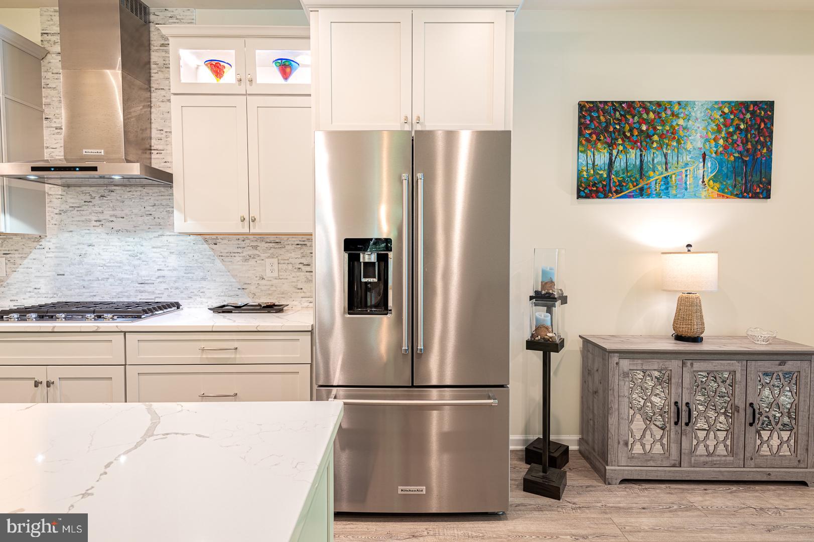 314 Tranquility Way Middletown, DE 19709 - Photo 13 of 56 a white refrigerator freezer sitting inside of a kitchen